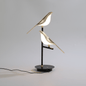 Golden Bird Wall Light – styled view